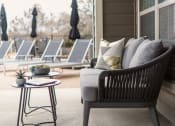 Thumbnail 13 of 29 - a patio chair with pillows on it