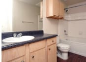 Thumbnail 17 of 32 - an empty bathroom with a sink toilet and bath tub