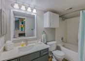 Thumbnail 6 of 29 - a bathroom with a sink toilet and bathtub