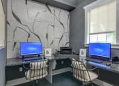 Thumbnail 12 of 29 - an office with two computers and two chairs