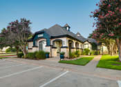 Thumbnail 29 of 29 - a house with a sidewalk and a parking lot