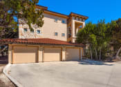 Thumbnail 27 of 33 - a garage with a two car garage door in front of a house