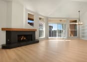 Thumbnail 19 of 33 - a living room with a fireplace