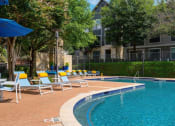Thumbnail 44 of 49 - pool side with lounge chairs