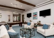 Thumbnail 28 of 49 - game room with white sofas