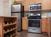 Thumbnail 17 of 49 - kitchen with wine bottle rack