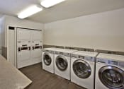 Thumbnail 23 of 27 - the preserve at ballantyne commons laundry room with washes and dryers