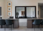Thumbnail 43 of 43 - a room with a table and chairs and a large mirror