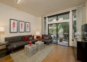 Thumbnail 4 of 23 - a living room with a leather couch and a zebra rug