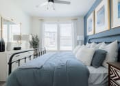 Thumbnail 9 of 43 - a bedroom with a bed and a window