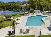 Thumbnail 25 of 52 - a swimming pool with chairs and umbrellas at the resort