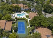 Thumbnail 27 of 52 - a birds eye view of a house with a tennis court and a pool