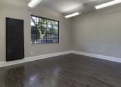 Thumbnail 13 of 52 - an empty room with exercise balls and a window