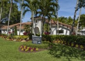 Thumbnail 52 of 52 - a sign in front of a house with palm trees