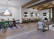 Thumbnail 22 of 48 - A modern living room with a wooden floor and white walls.