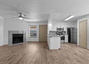 Thumbnail 16 of 43 - A spacious kitchen with a fireplace and a refrigerator.