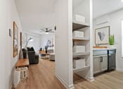 Thumbnail 7 of 28 - a living room and kitchen area with white walls and hardwood flooring