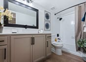 Thumbnail 8 of 28 - a bathroom with white walls and a wooden floor