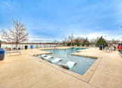 Thumbnail 41 of 52 - a swimming pool at a resort with chairs in it