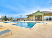 Thumbnail 38 of 52 - a swimming pool with a building in the background