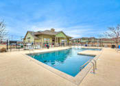 Thumbnail 43 of 52 - a swimming pool with a house in the background