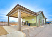 Thumbnail 29 of 52 - a gas station with a blue sky in the background