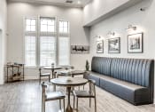 Thumbnail 19 of 52 - the reserve at bucklin hill leasing office common area with couch and tables