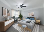 Thumbnail 21 of 39 - a bedroom with a large bed and a ceiling fan