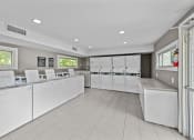 Thumbnail 11 of 17 - the laundry room is equipped with washers and dryers
