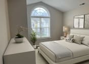 Thumbnail 4 of 36 - a bedroom with a bed and a dresser and a window