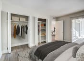 Thumbnail 3 of 18 - a bedroom with a bed and a closet