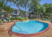 Thumbnail 8 of 24 - A small pool surrounded by a brick border.
