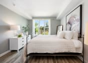 Thumbnail 12 of 66 - a bedroom with a large bed and a window