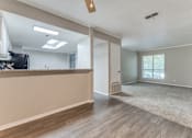 Thumbnail 12 of 20 - a living room with hardwood floors and a large window