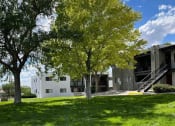 Thumbnail 6 of 11 - a building with a staircase and trees in front of it