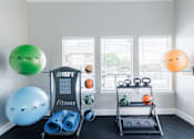 Thumbnail 19 of 29 - A room with a Smart Fitness equipment set up.