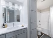 Thumbnail 5 of 62 - A bathroom with a white toilet and a white shower curtain.