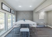 Thumbnail 29 of 62 - A dining room with a white table and chairs.