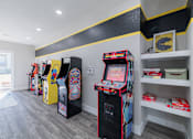 Thumbnail 35 of 62 - A row of arcade machines are lined up in a room.
