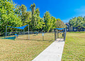Thumbnail 58 of 62 - A park with a volleyball net and a badminton net.