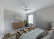 Thumbnail 4 of 62 - A bedroom with a bed, a dresser, a ceiling fan, and a window with a plant.