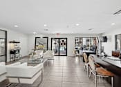 Thumbnail 37 of 38 - A spacious lobby with white furniture and a reception desk.
