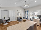 Thumbnail 9 of 22 - A room with a long table and chairs.