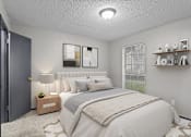 Thumbnail 5 of 22 - A bedroom with a large bed and a nightstand with a lamp.