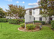 Thumbnail 21 of 22 - A sign for Harwell apartments stands in a grassy area.