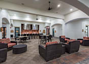 Thumbnail 20 of 40 - A large room with tables and chairs.