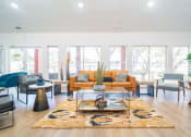 Thumbnail 2 of 20 - a living room with a couch and a coffee table