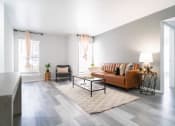 Thumbnail 4 of 20 - a living room with a couch and a table