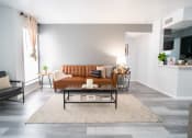 Thumbnail 5 of 20 - a living room with a couch and a coffee table