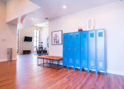 Thumbnail 18 of 20 - a large room with blue lockers in the middle of it